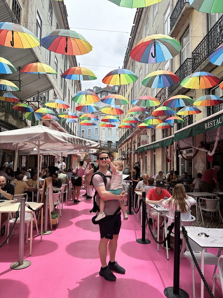 Pink Street with umbrellas in Lisbon